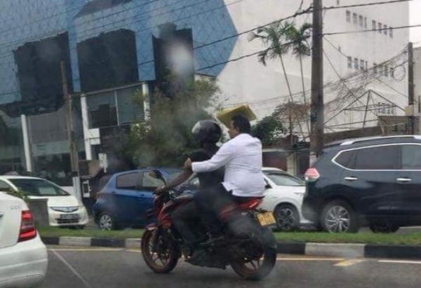 Education Minister Seen Flouting Traffic Laws During Cheap PR Stunt: Rides On Pillion Of Bike To Avoid Severe Traffic