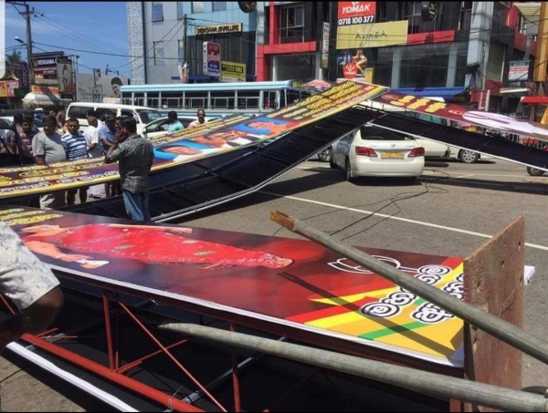 Hoarding Erected By Kanthi Kodikara In Support Of SLPP Candidate Gotabhaya Rajapaksa Fall Injuring Person And Damaging Car
