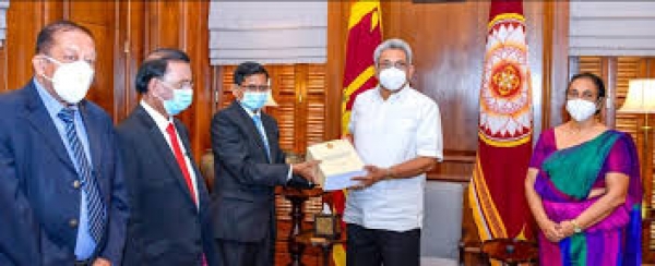 Handing over the PCOI report to the President